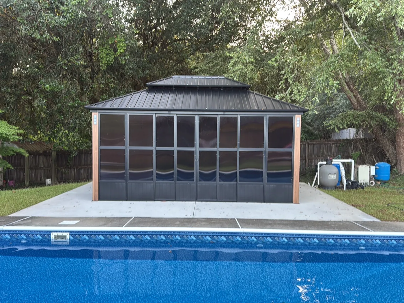 Screened solarium assembled poolside in Pensacola